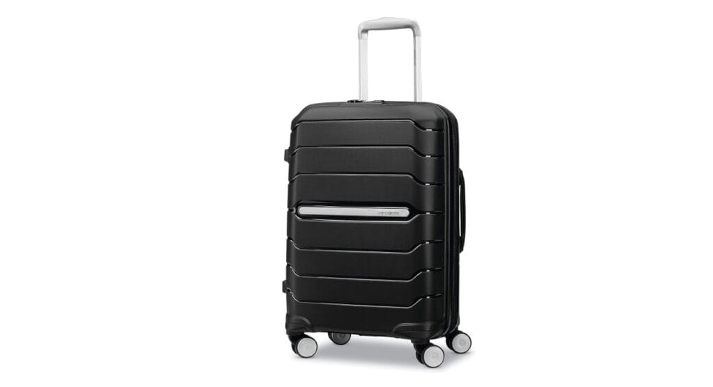 Samsonite Freeform hard shell 20-inch carry-on suitcase in black featuring smooth spinner wheels and premium design.
