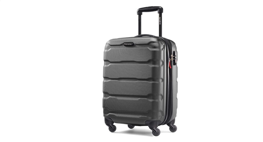 Samsonite Omni PC Hardside expandable carry-on suitcase in black with sturdy shell and four spinner wheels.