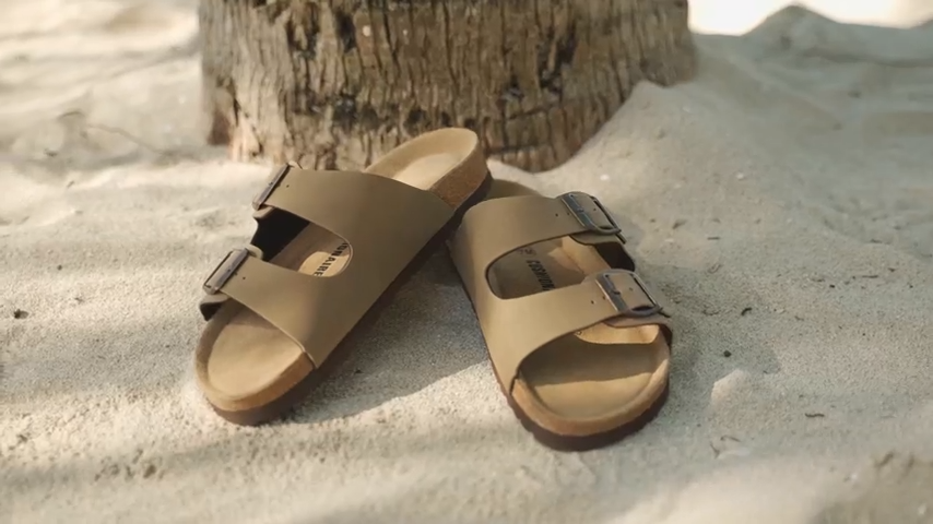 CUSHIONAIRE Luna Sandals on a foot in casual outfit